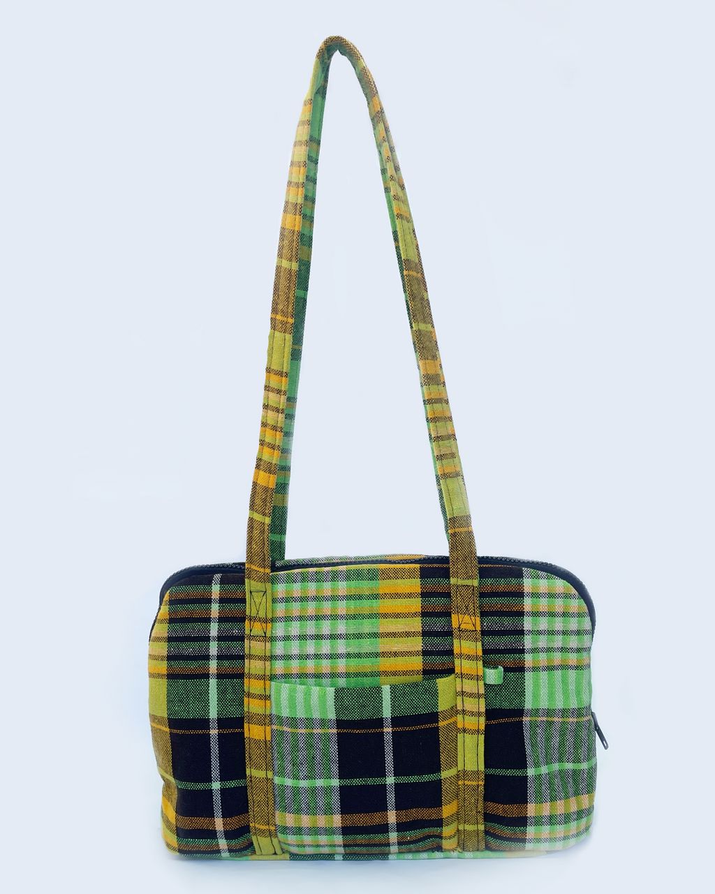 Green and yellow plaid patterned handbag on a white background