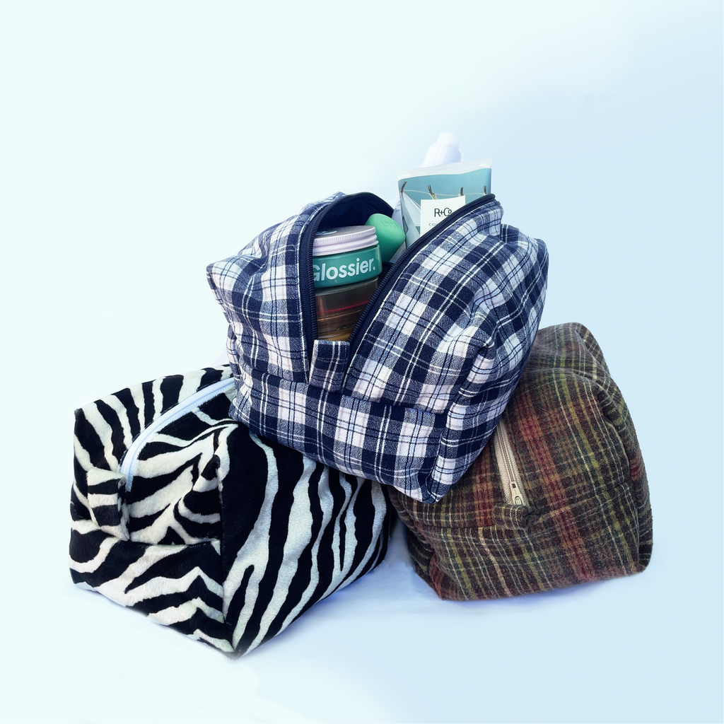 Three fabric bags with different patterns on a white background